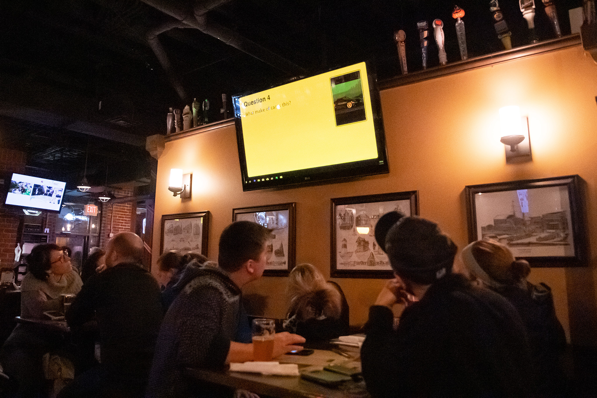U Pick 6 Pub Trivia look at question on tv